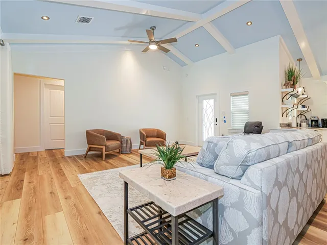 a living room with furniture and a table