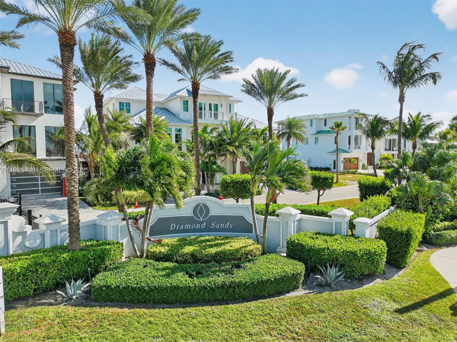 8308 South Ocean Drive Jensen Beach, FL 34957 - Photo 11 of 21 a view of a backyard with plants and palm tree