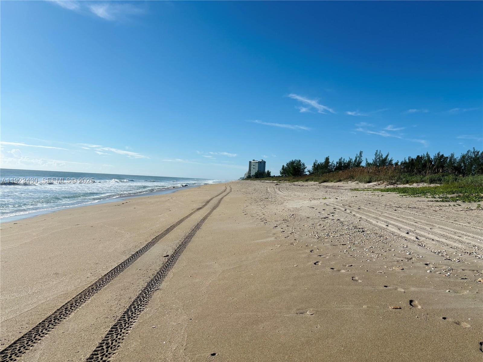 8308 South Ocean Drive Jensen Beach, FL 34957 - Photo 20 of 21 a view of an ocean beach