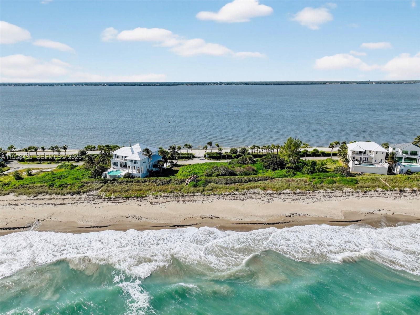 8308 South Ocean Drive Jensen Beach, FL 34957 - Photo 6 of 21 an ocean beach with an outdoor space