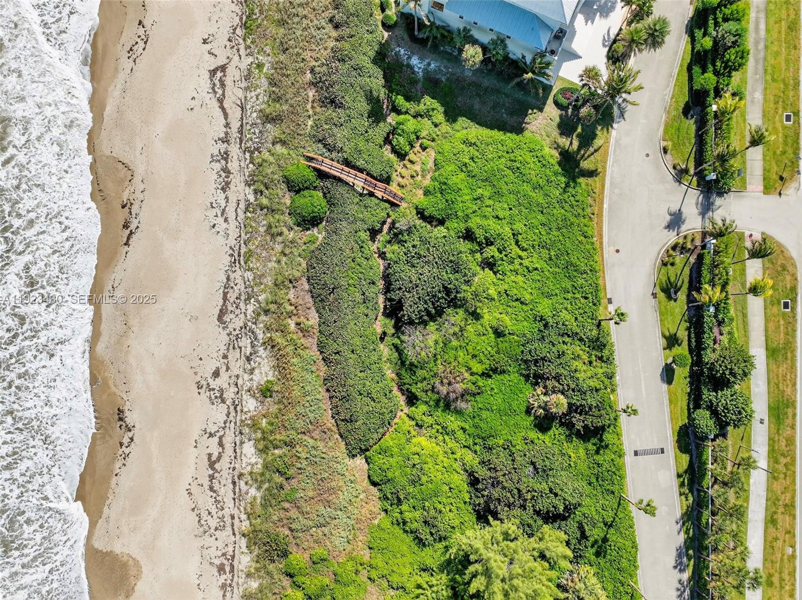 8308 South Ocean Drive Jensen Beach, FL 34957 - Photo 10 of 21 a view of a garden