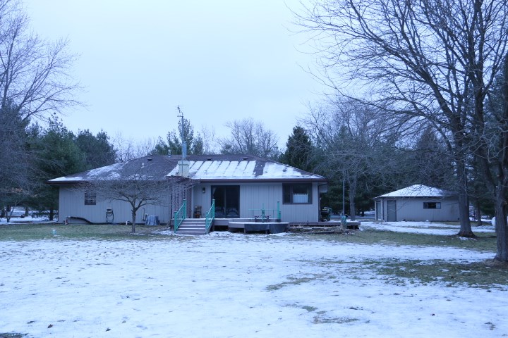 3442 Yale Bridge Road Rockton, IL 61072 - Photo 6 of 27 a view of a house with a yard and hanging chair