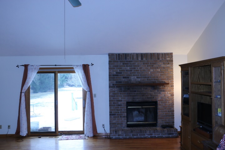 3442 Yale Bridge Road Rockton, IL 61072 - Photo 7 of 27 a living room with a fireplace and wooden floor