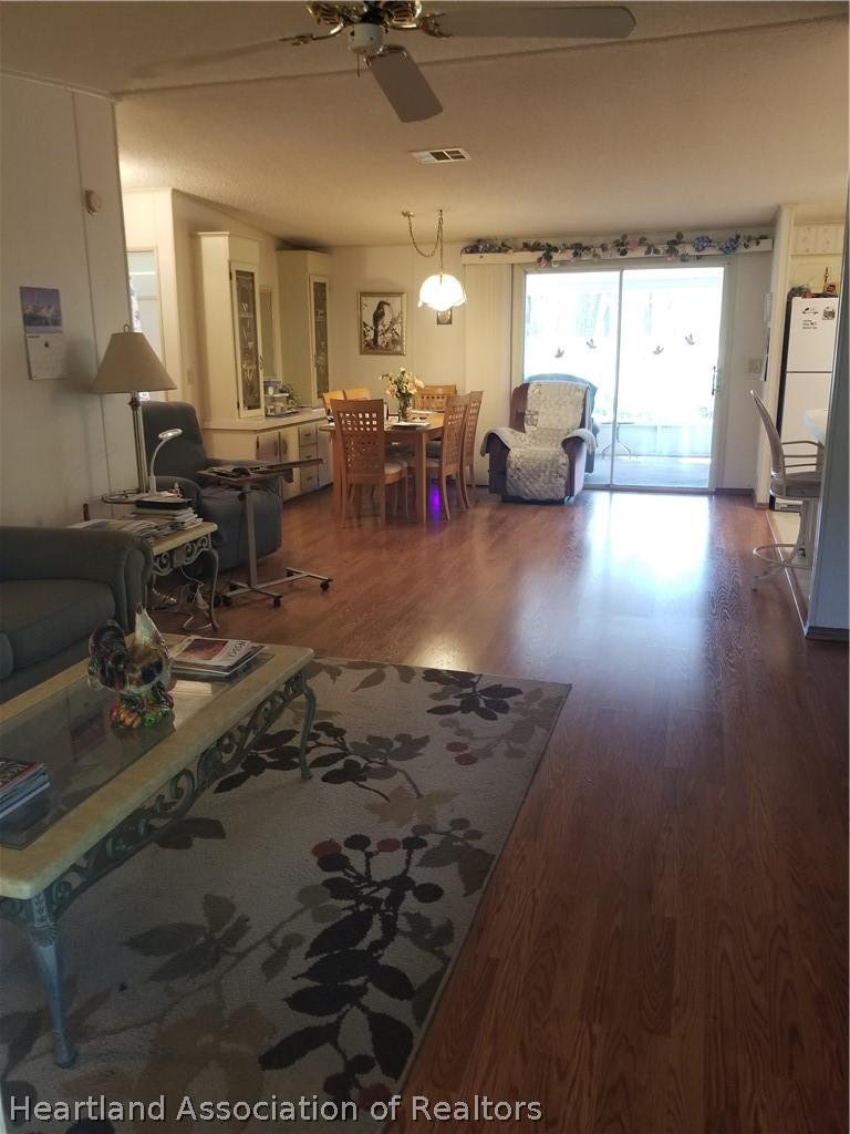 9125 Spur Path Sebring, FL 33875 - Photo 11 of 31 Open living room/ dining area.