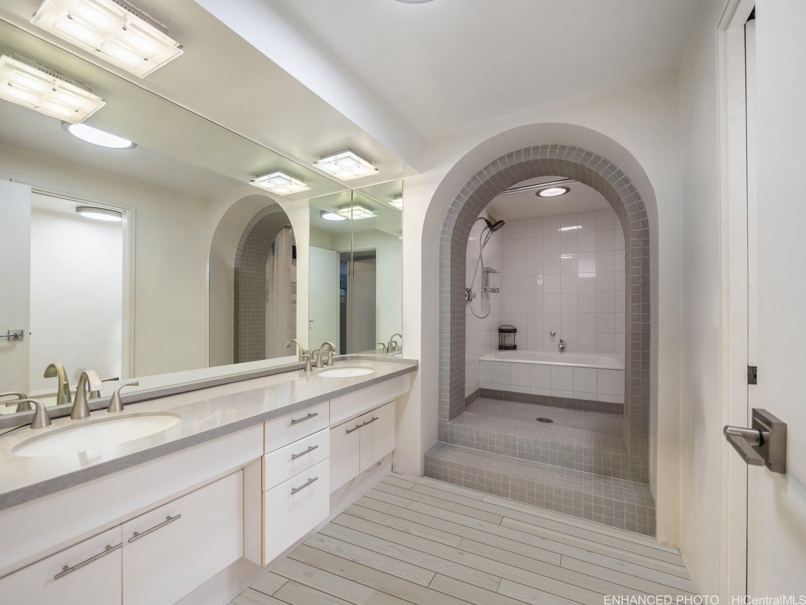 425 South Street, Unit 501 Honolulu, HI 96813 - Photo 12 of 25 a spacious bathroom with a granite countertop sink mirror and