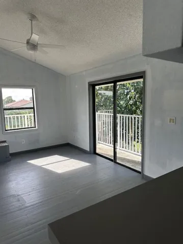 a view of an empty room with a window