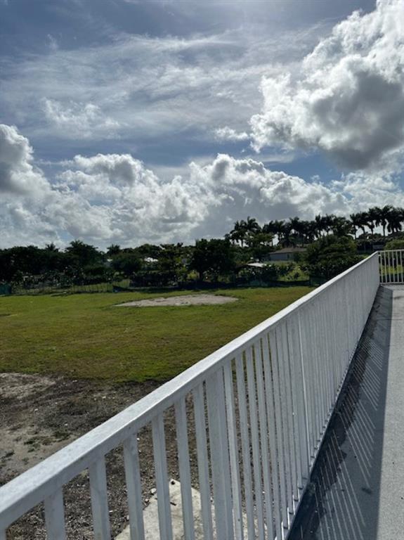 24001 Southwest 202nd Avenue Homestead, FL 33031 - Photo 9 of 17 a view of a balcony with lake
