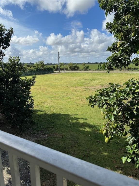 24001 Southwest 202nd Avenue Homestead, FL 33031 - Photo 10 of 17 a view of a lake with a big yard