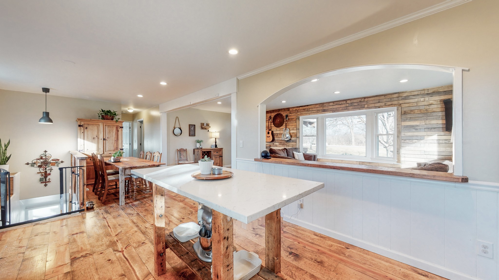 2615 Baugh Road Thompson's Station, TN 37179 - Photo 11 of 60 a open dining room with kitchen island furniture a large window and stainless steel appliances