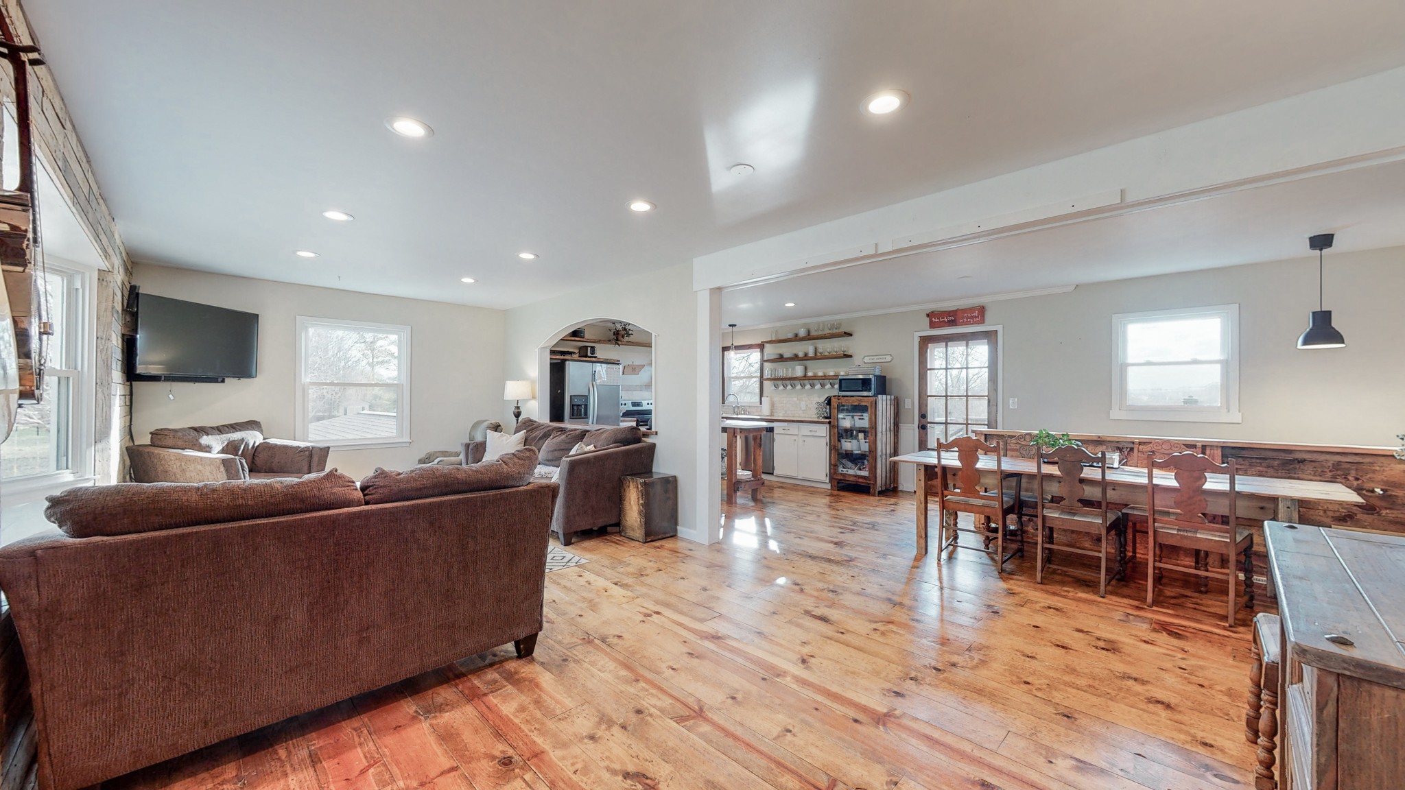 2615 Baugh Road Thompson's Station, TN 37179 - Photo 2 of 60 a living room with furniture a wooden floor and a flat screen tv