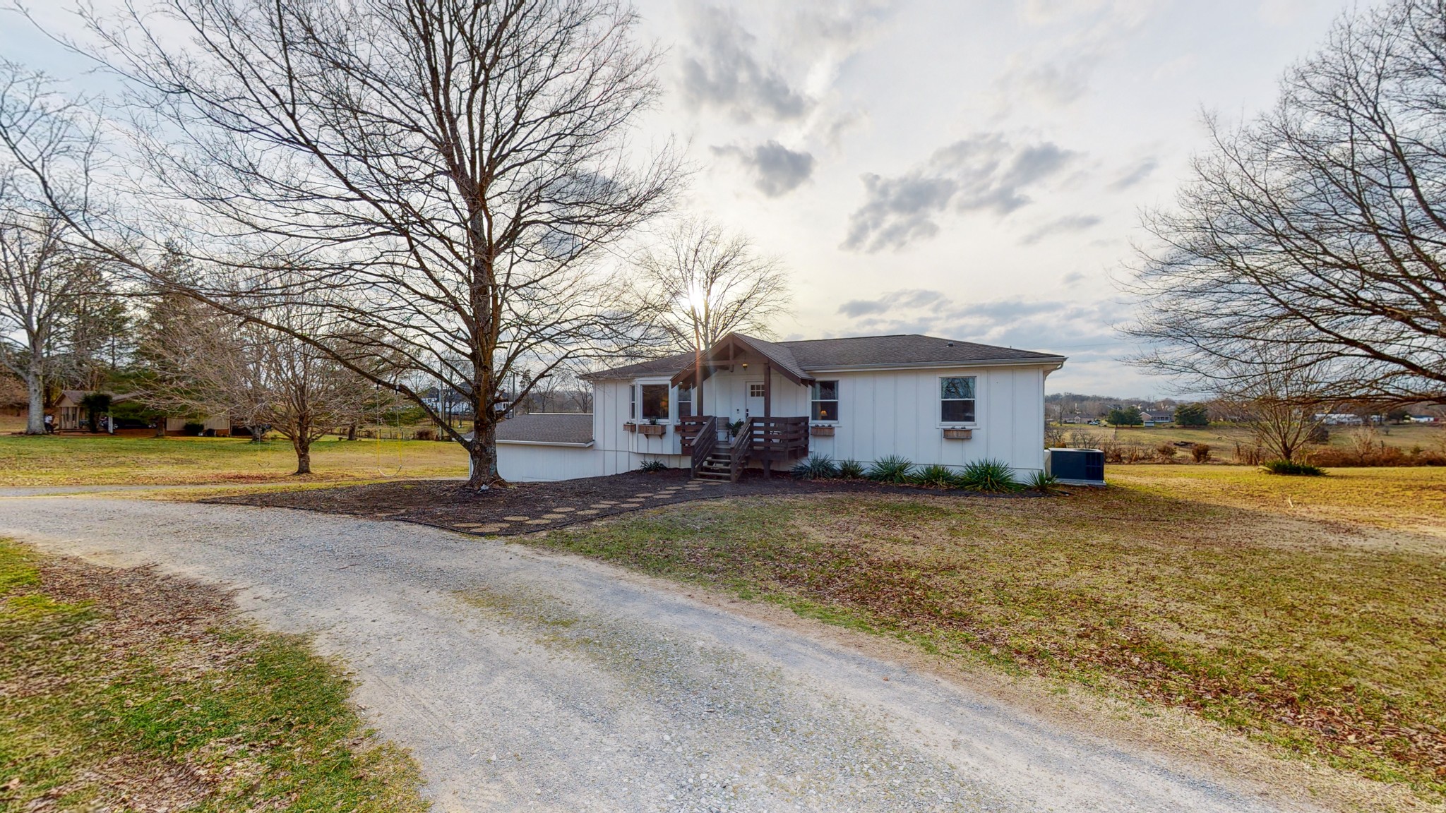 2615 Baugh Road Thompson's Station, TN 37179 - Photo 36 of 60 a view of a yard with a large tree in front of the house