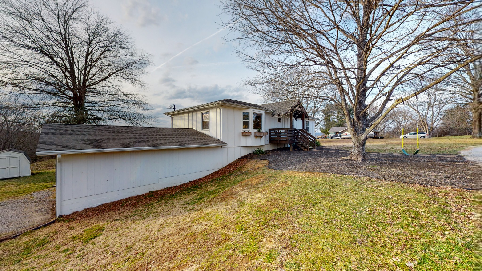 2615 Baugh Road Thompson's Station, TN 37179 - Photo 38 of 60 a view of a yard with a house and trees