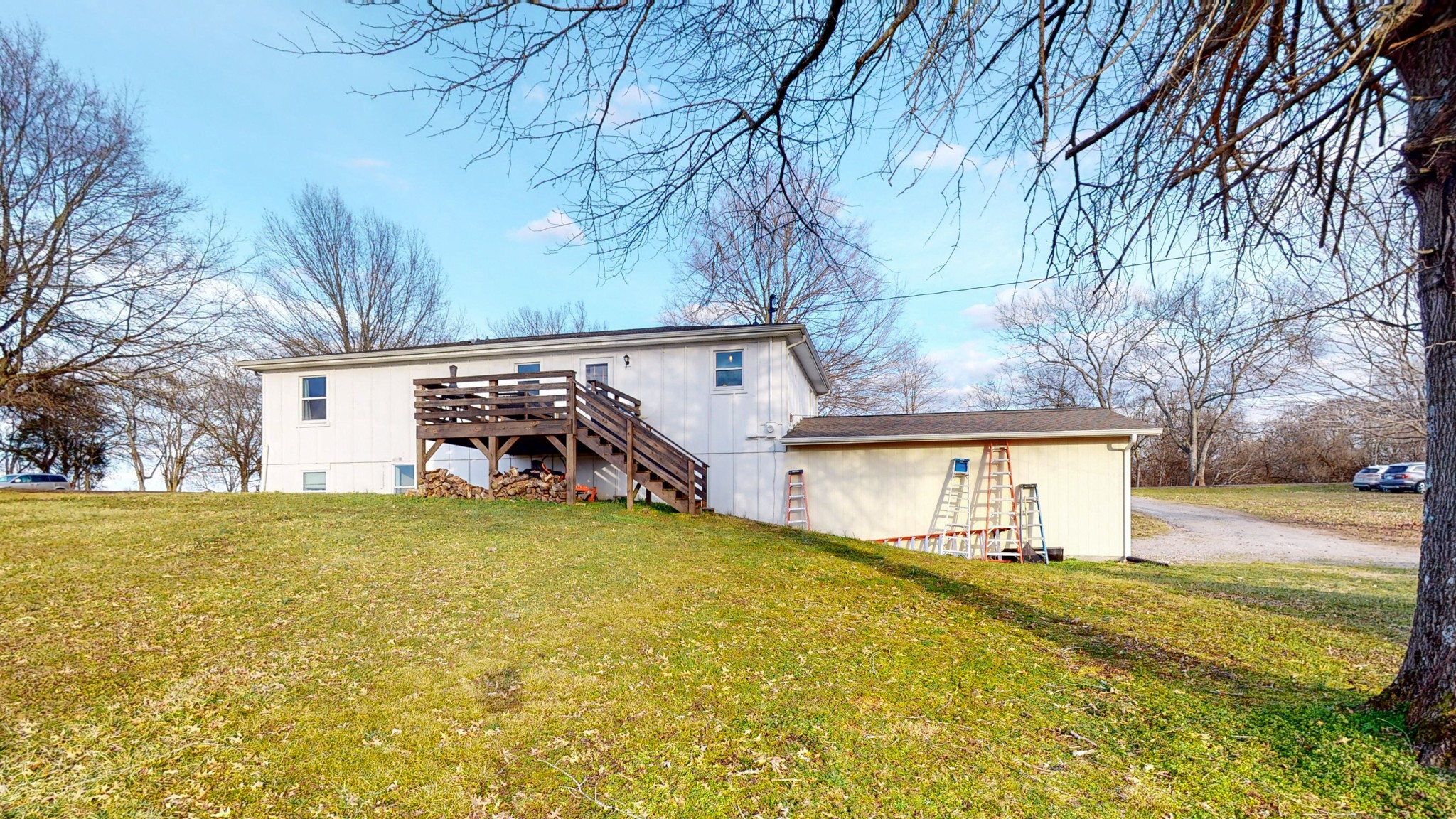 2615 Baugh Road Thompson's Station, TN 37179 - Photo 49 of 60 a view of a house with a yard and garage