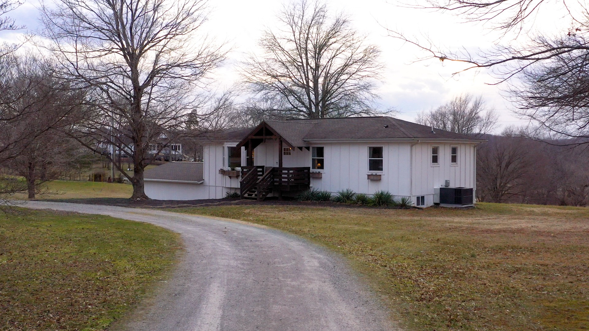 2615 Baugh Road Thompson's Station, TN 37179 - Photo 55 of 60 a front view of a house with a yard and trees