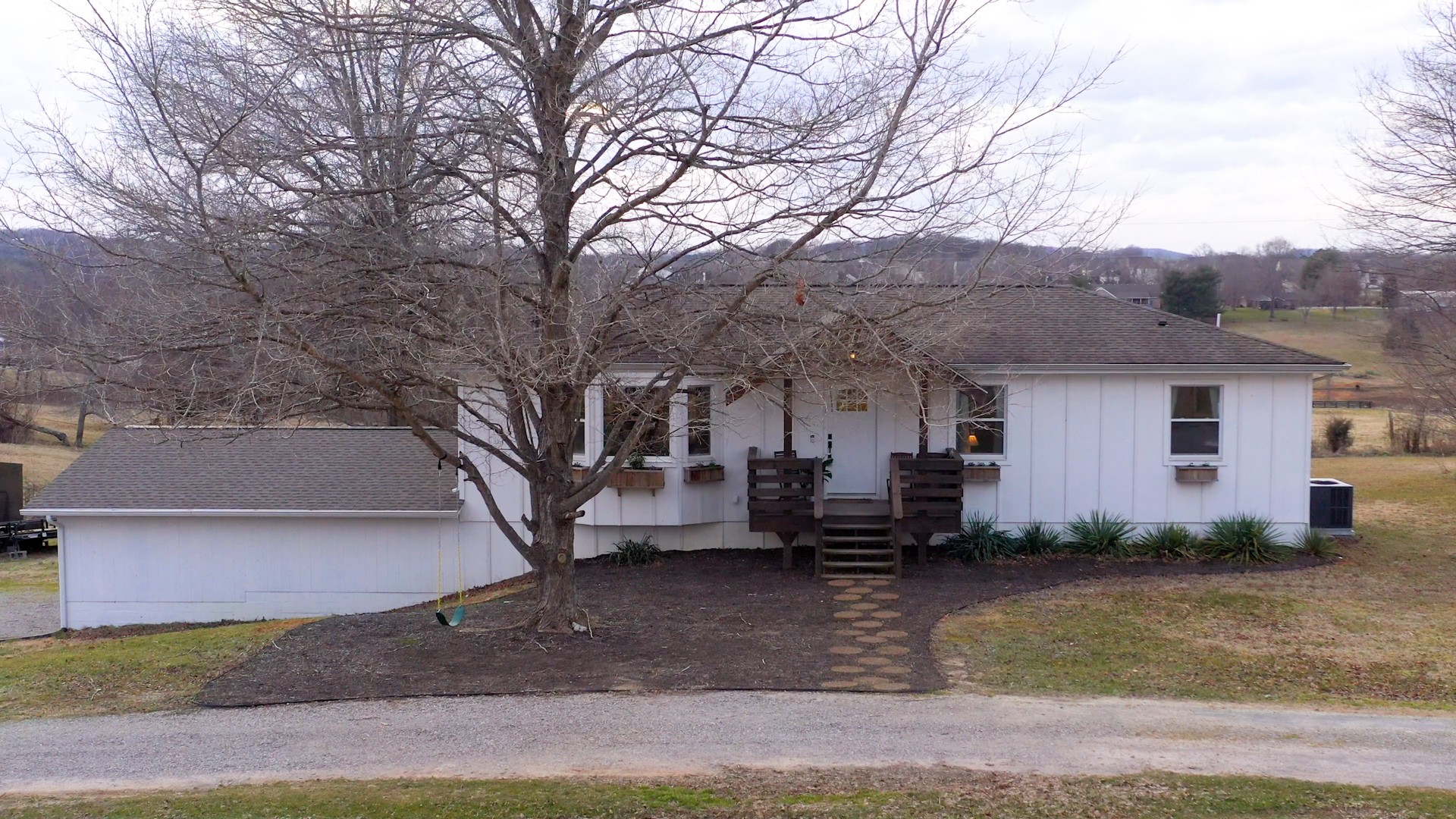 2615 Baugh Road Thompson's Station, TN 37179 - Photo 60 of 60 a view of a house with a yard covered in snow