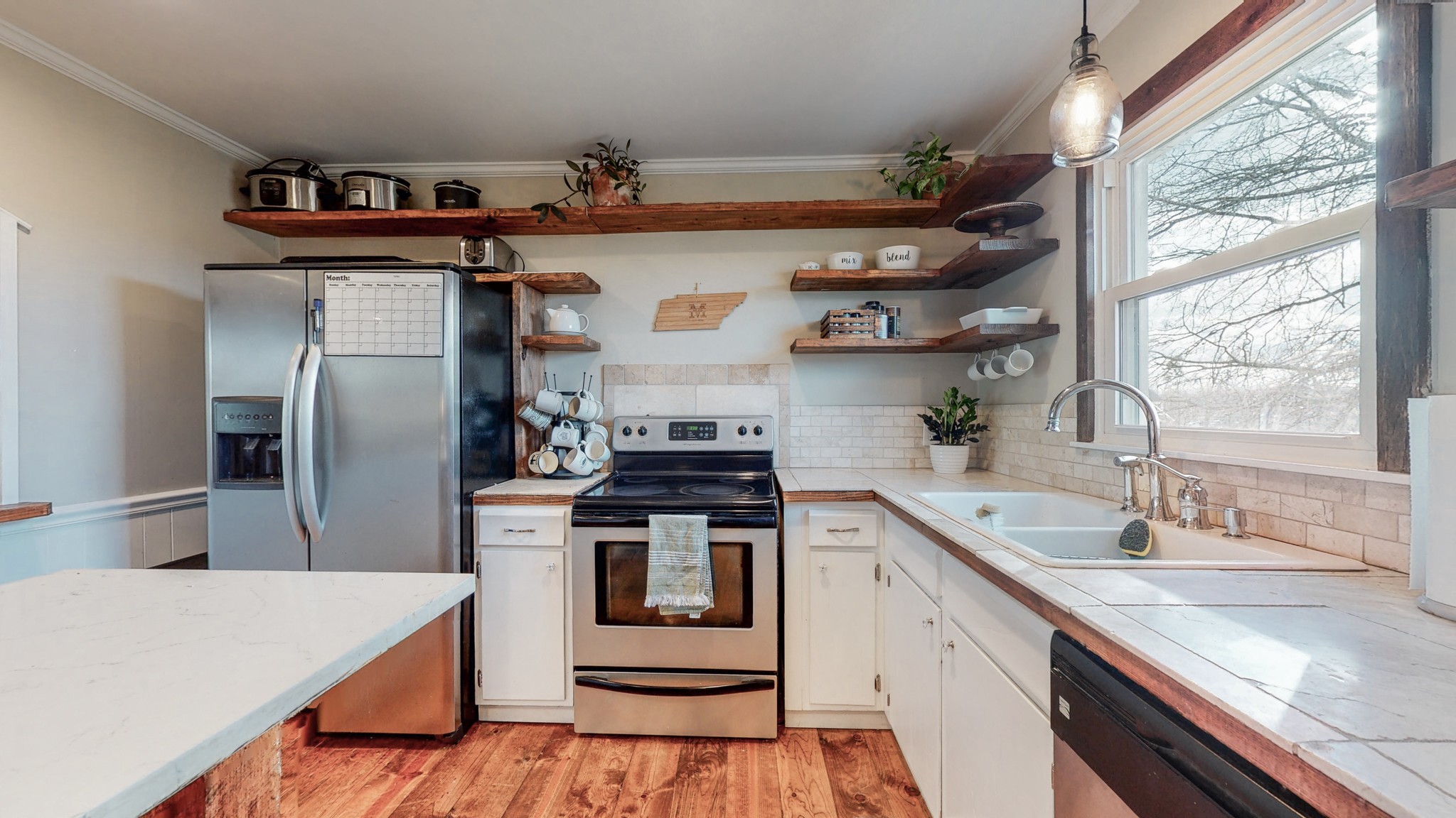 2615 Baugh Road Thompson's Station, TN 37179 - Photo 10 of 60 a kitchen with stainless steel appliances a sink stove and refrigerator