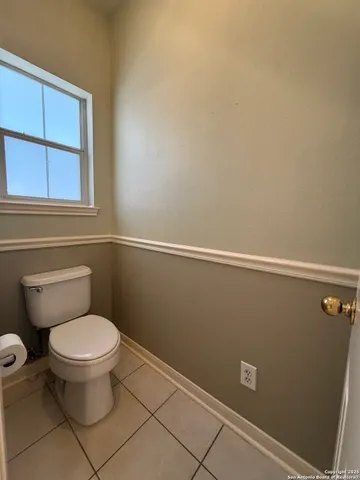 a bathroom with a toilet and a sink