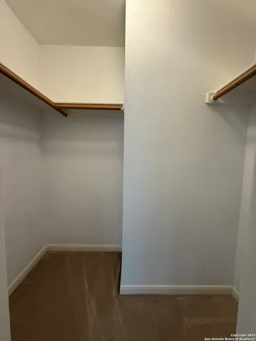 a bathroom with a granite countertop sink and mirror