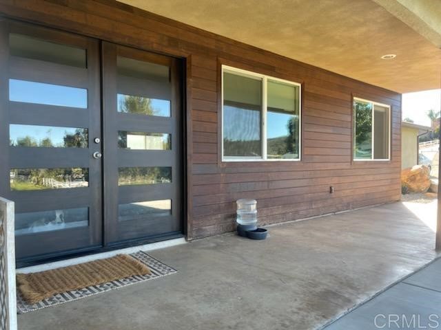 a view of a brick house with outdoor space