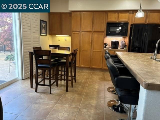 a view of kitchen island with cabinets