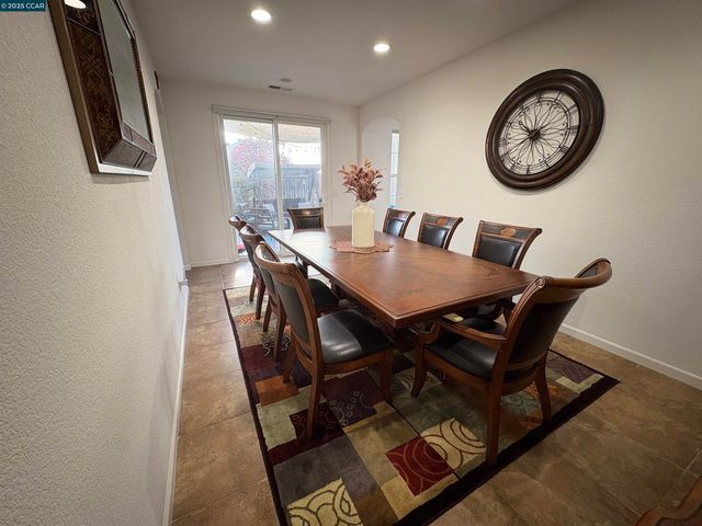 a view of a dining room with furniture and window