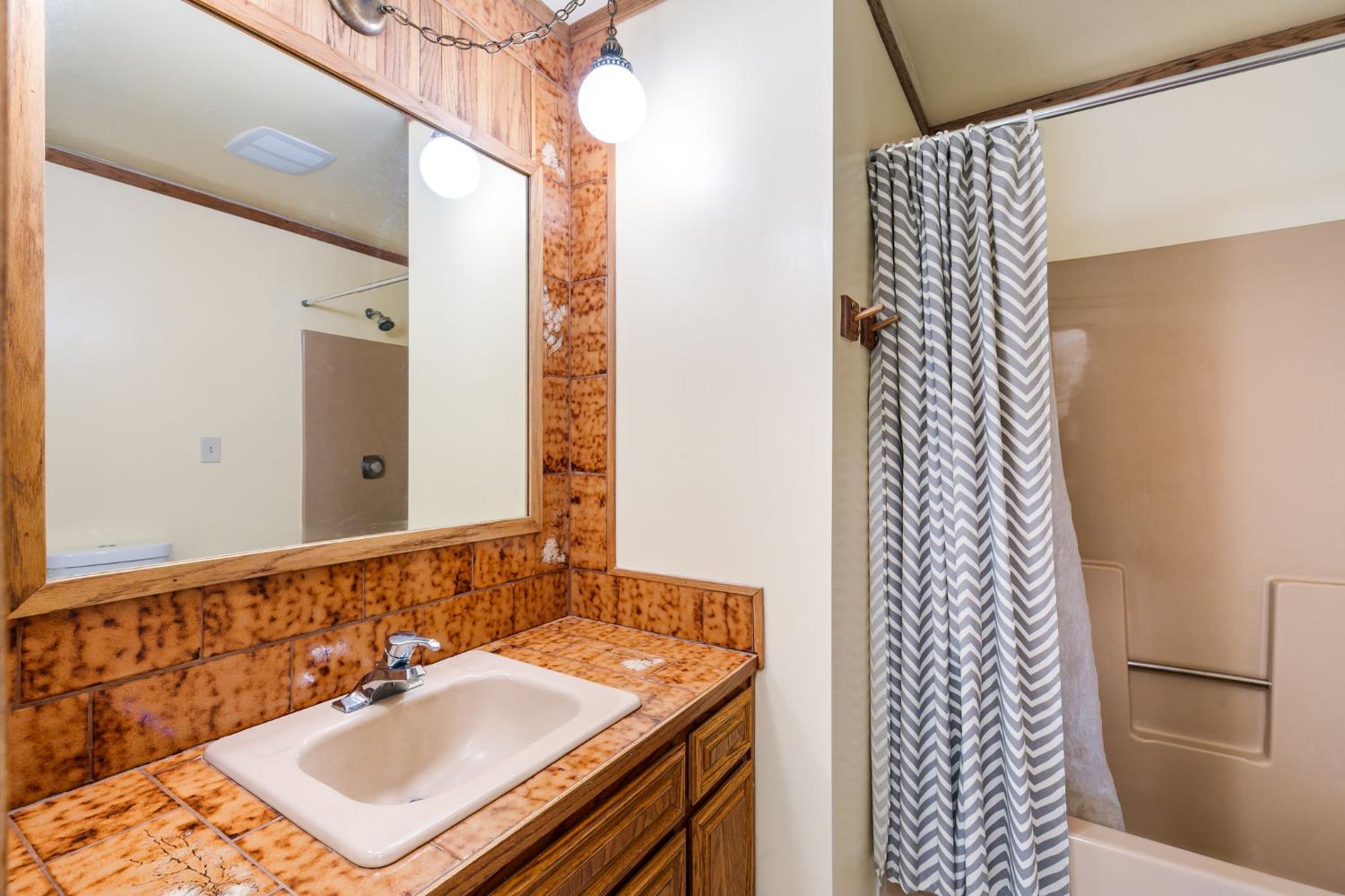 10265 Newtown Road Nevada City, CA 95959 - Photo 14 of 35 a bathroom with a sink and a mirror