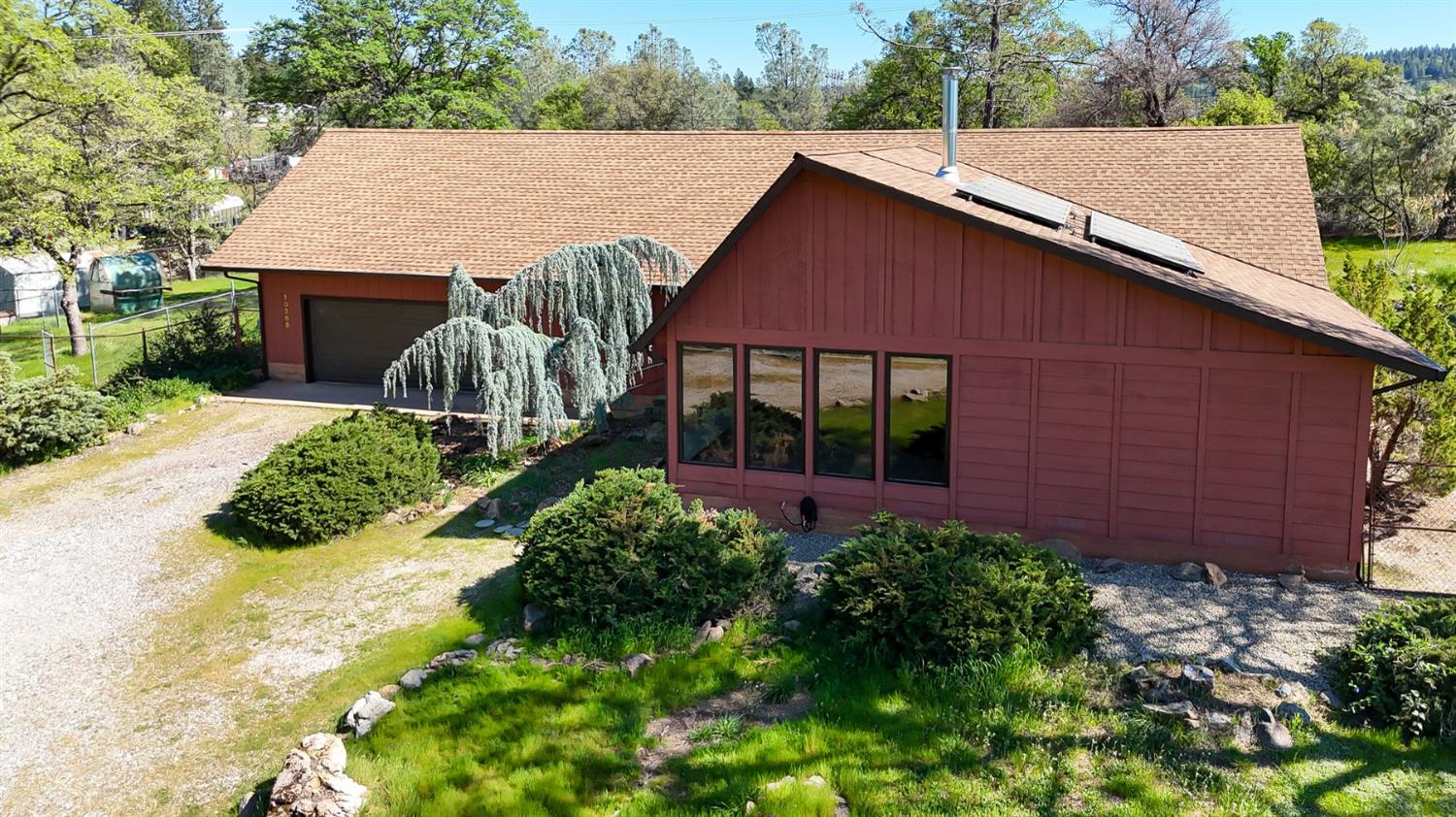 10265 Newtown Road Nevada City, CA 95959 - Photo 30 of 35 a aerial view of a house with table and chairs in a yard