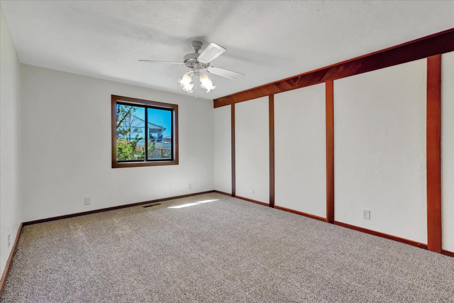 10265 Newtown Road Nevada City, CA 95959 - Photo 9 of 35 an empty room with windows and fan