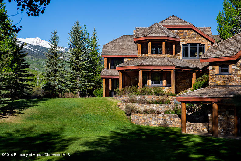 1500 Owl Creek Ranch Road Aspen, CO 81611 - Photo 4 of 18 a front view of a house with a garden