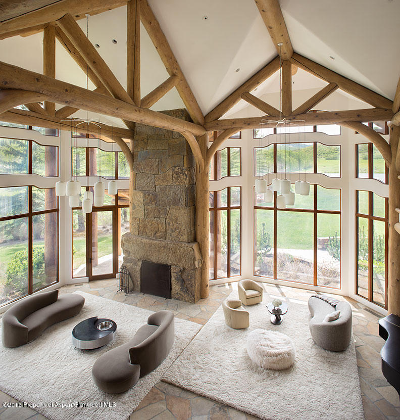 1500 Owl Creek Ranch Road Aspen, CO 81611 - Photo 9 of 18 a dining room with furniture and a large window