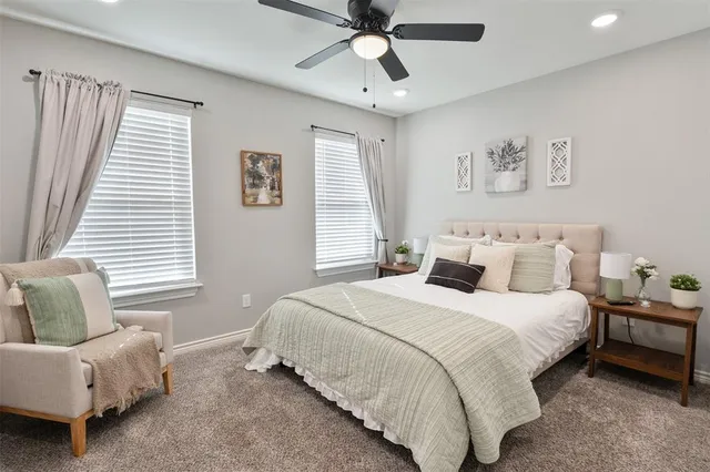 a bedroom with a bed and a couch