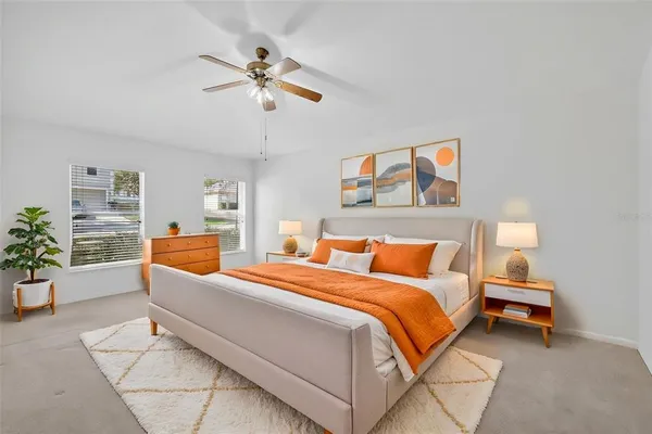 a bedroom with a bed and a couch