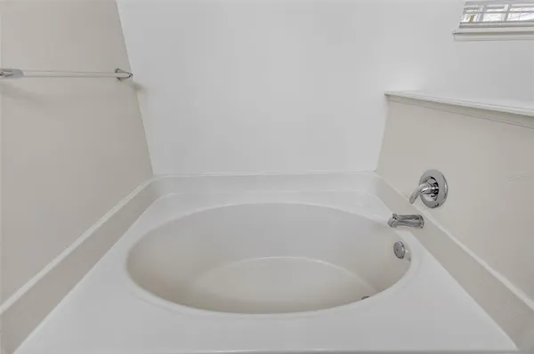 a white bath tub sitting in a bathroom