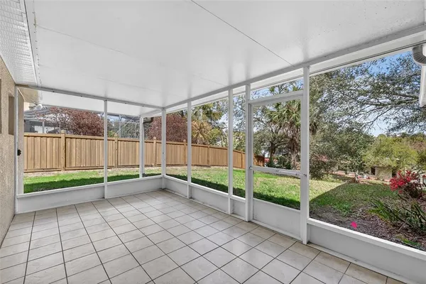 a view of a room with wooden floor and wooden fence