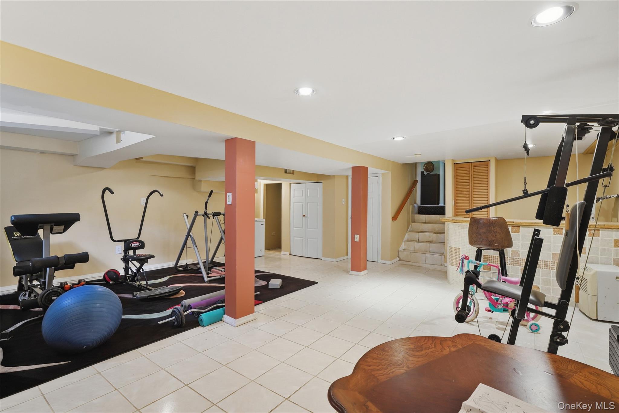 623 Cardinal Road Cortlandt Manor, NY 10567 - Photo 28 of 40 a room with gym equipment and white walls