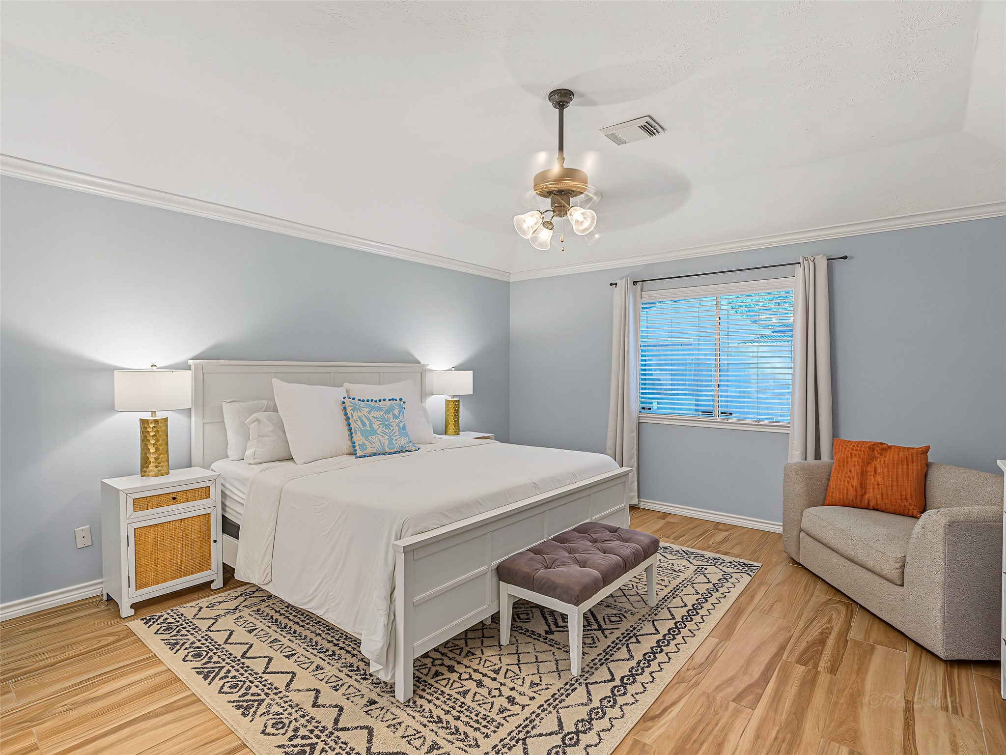 1310 Hidden Canyon Road Katy, TX 77450 - Photo 21 of 40 Spacious Primary Bedroom with soothing neutral walls and a cozy seating area by the window.