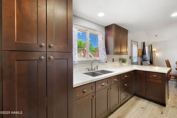 a kitchen with a sink and cabinets