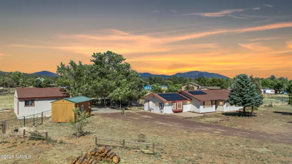 a view of a town with large trees