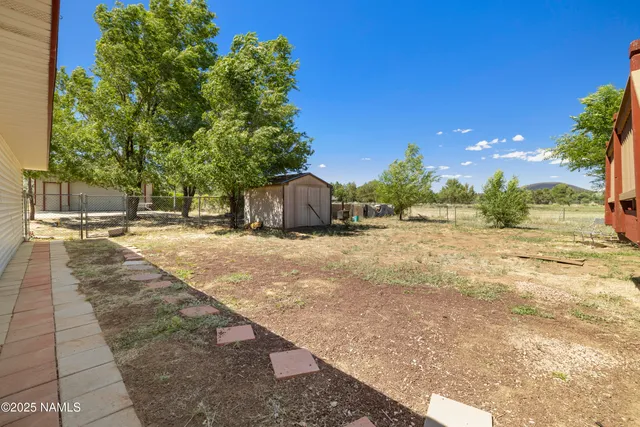 a view of a yard with a house
