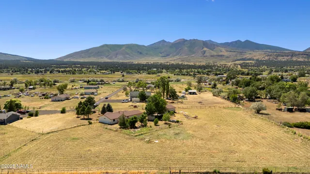 a view of a town with mountains in the background