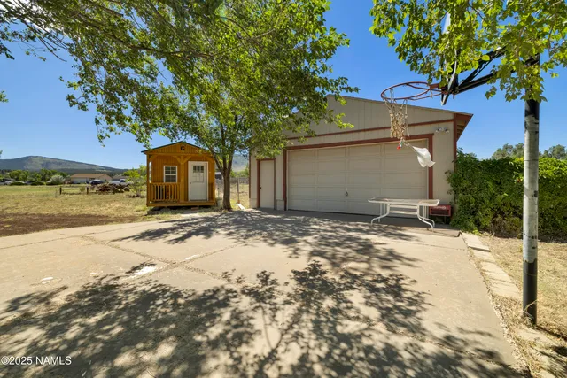 a roof deck with table and chairs