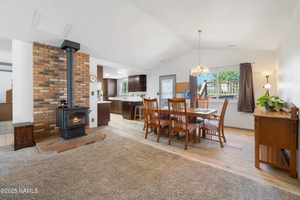 a view of a livingroom with furniture and a fireplace