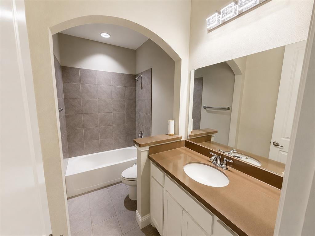 6209 Cupleaf Road Flower Mound, TX 76226 - Photo 25 of 29 Bathroom featuring a vanity with a single basin sink, polished chrome faucet, and integrated brown countertop
