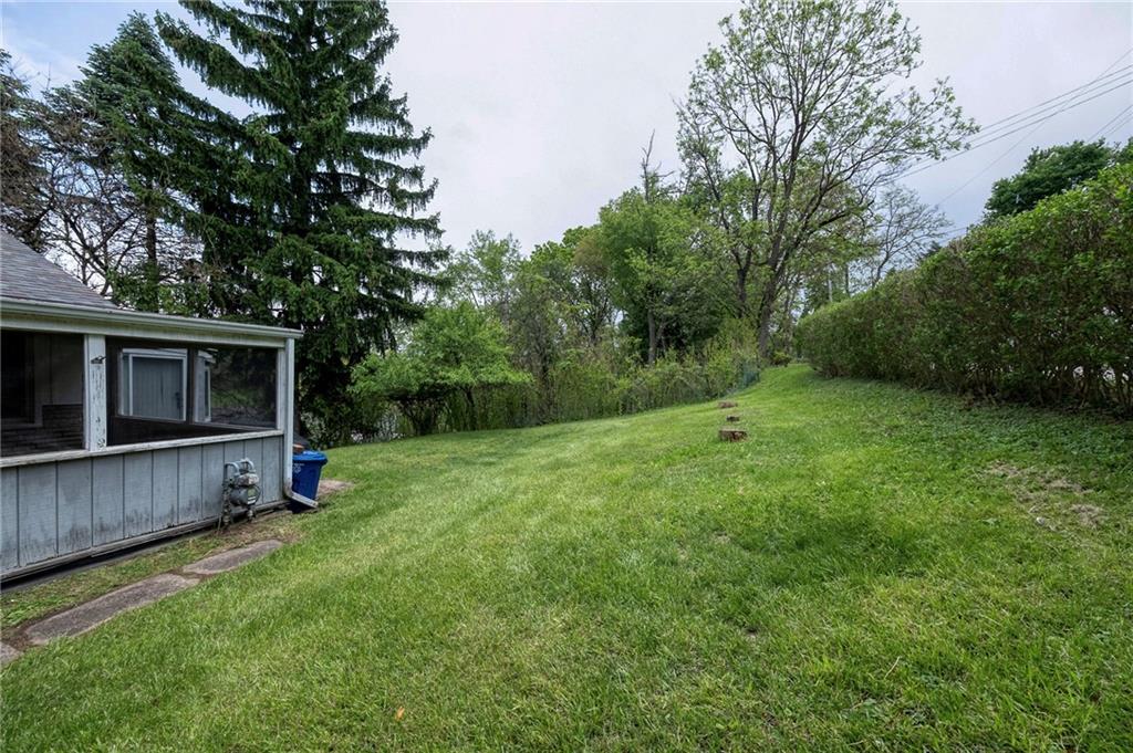 531 Laughlin Avenue Pittsburgh, PA 15210 - Photo 26 of 35 a view of a backyard with potted plants and large trees