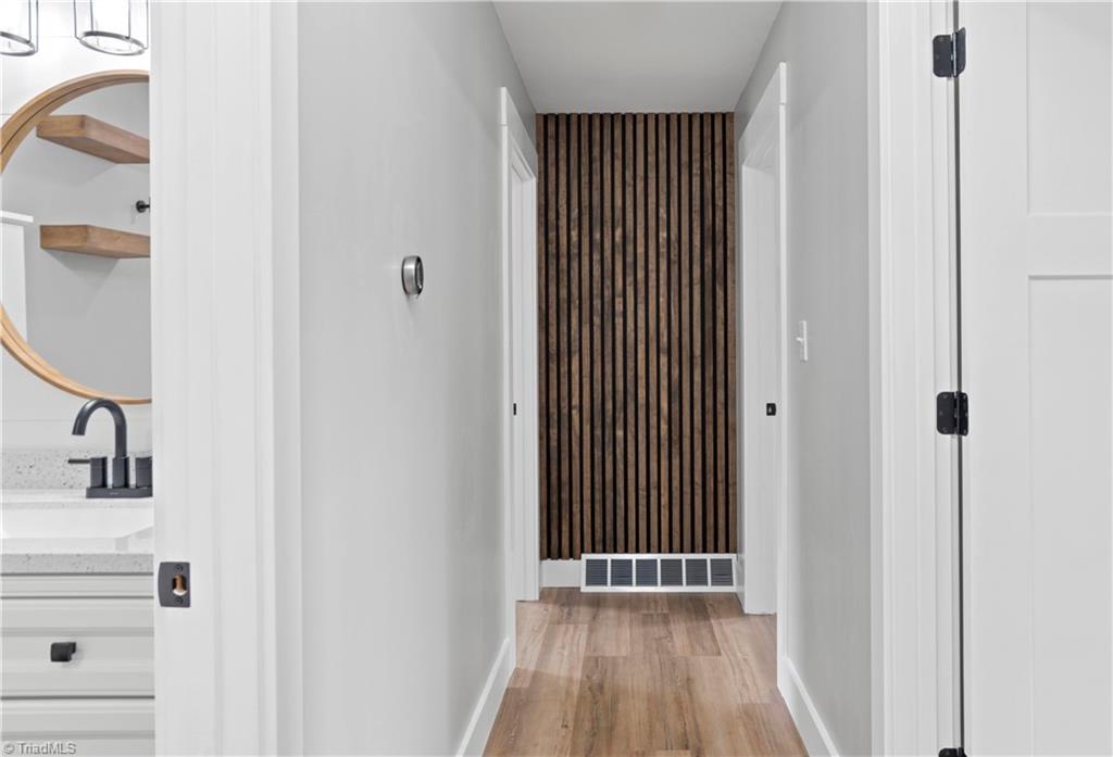 5811 Moravia Road Winston-Salem, NC 27127 - Photo 11 of 40 Corridor to bathroom and bedrooms