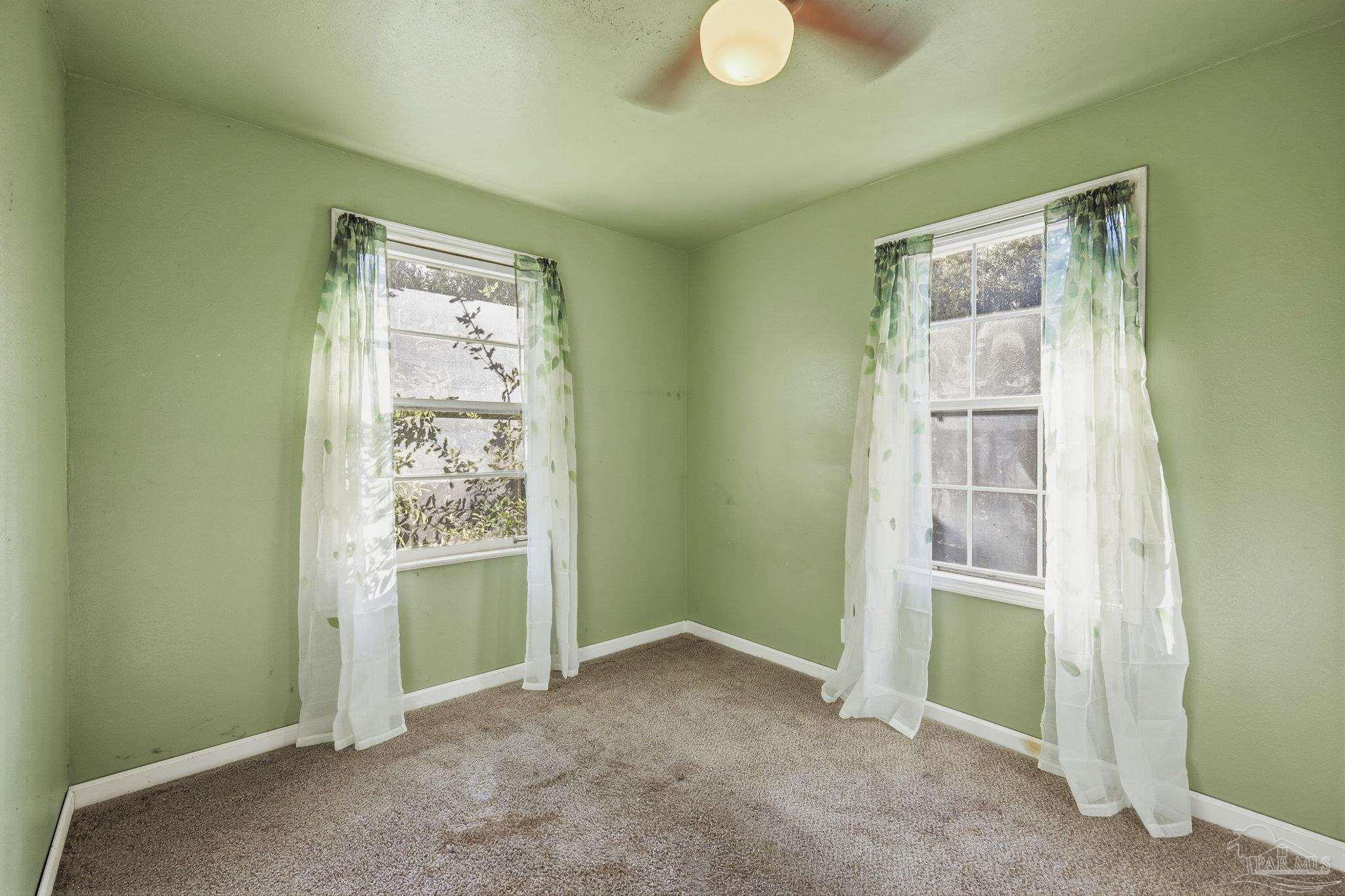 525 Pelham Road Pensacola, FL 32507 - Photo 18 of 28 a view of an empty room with a window