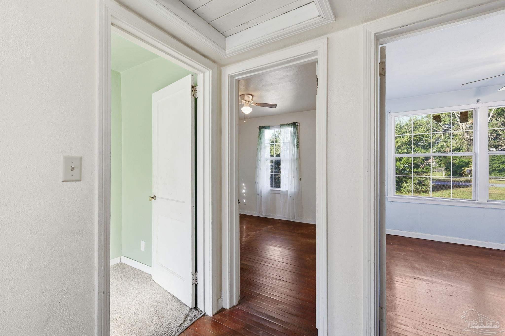 525 Pelham Road Pensacola, FL 32507 - Photo 21 of 28 a view of a hallway with wooden floor and a room