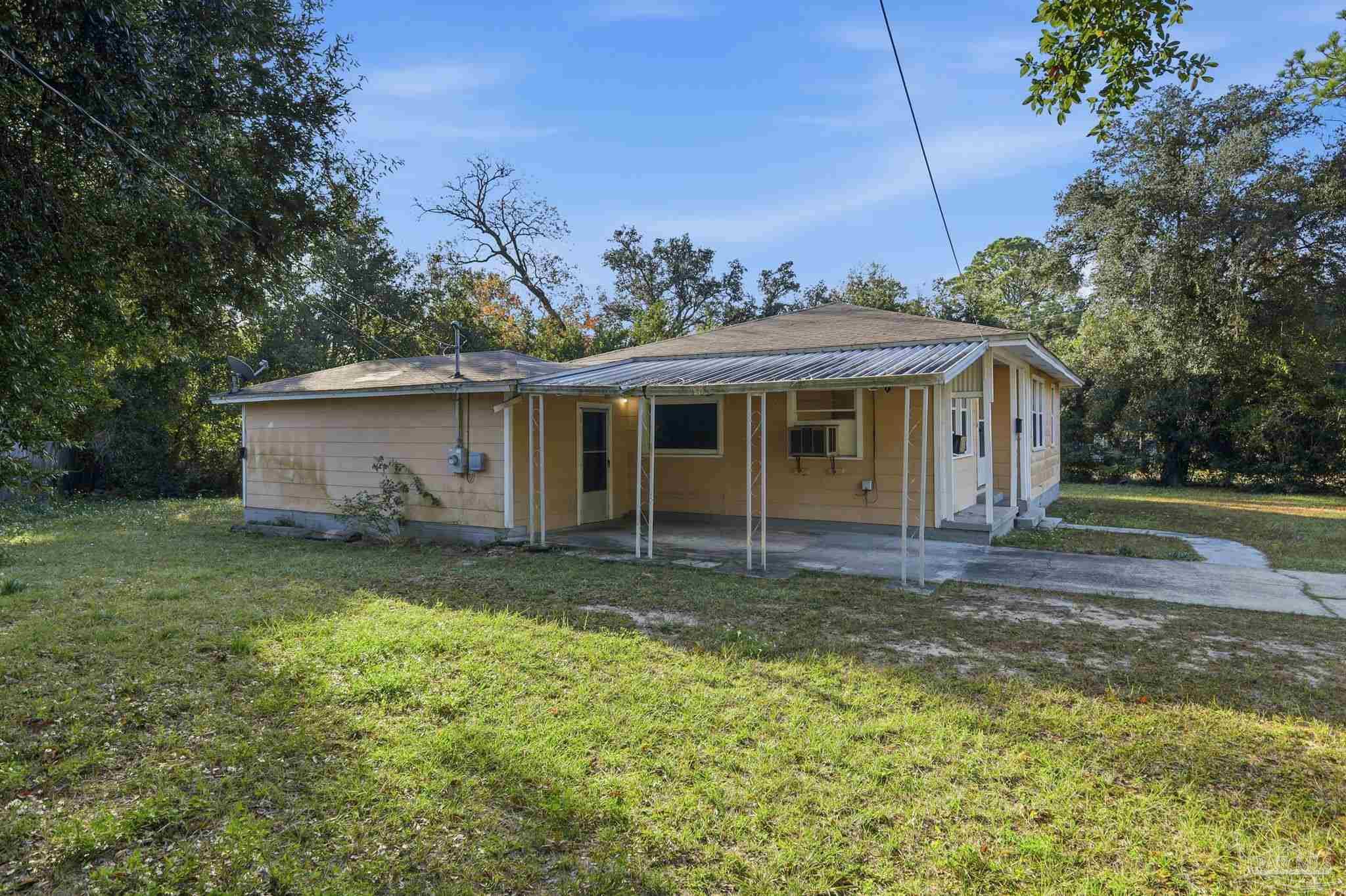 525 Pelham Road Pensacola, FL 32507 - Photo 4 of 28 a view of a house with a yard