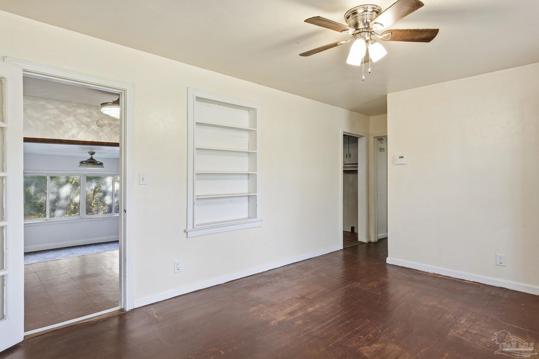 525 Pelham Road Pensacola, FL 32507 - Photo 8 of 28 wooden floor in an empty room with a window