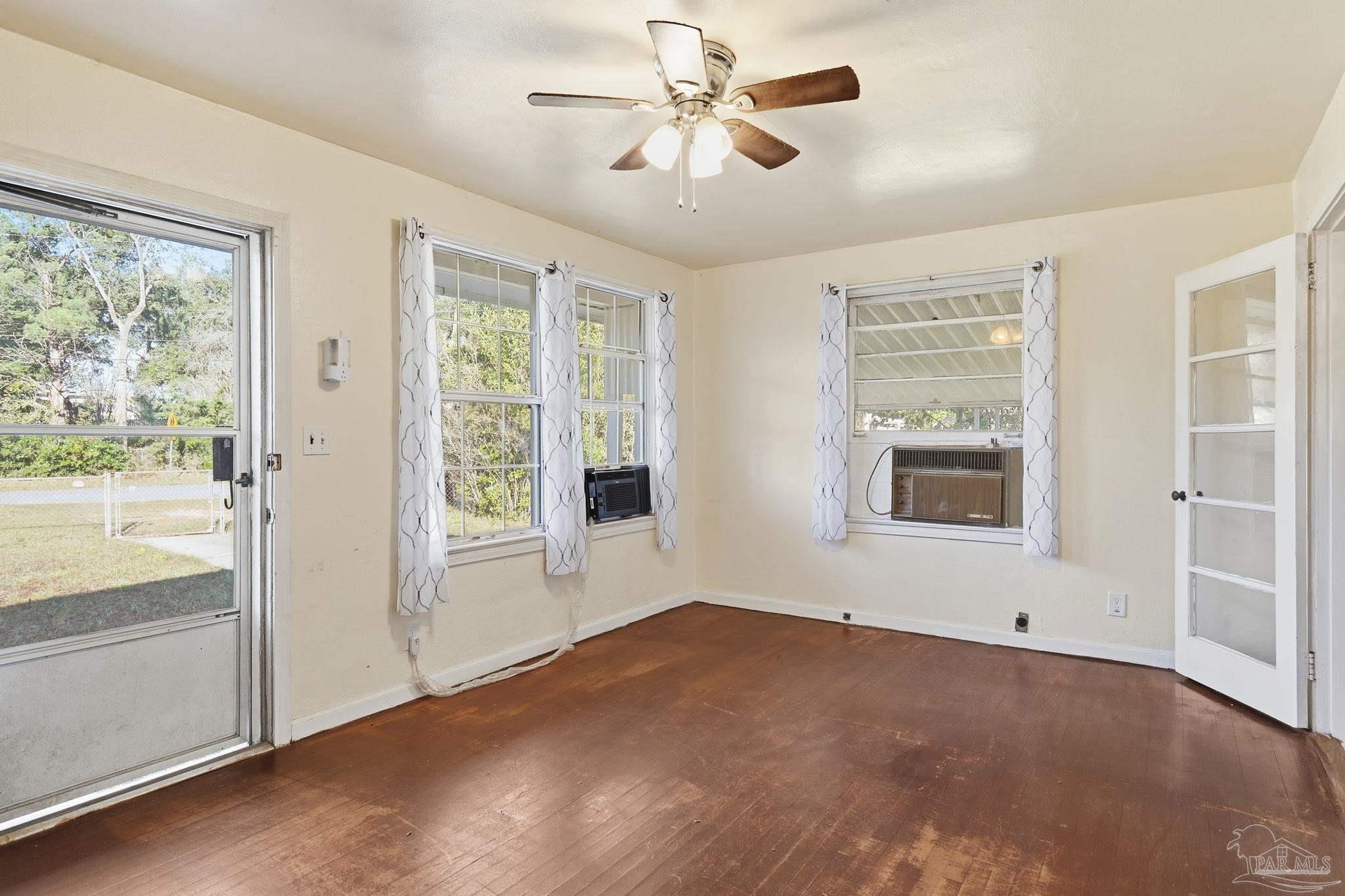 525 Pelham Road Pensacola, FL 32507 - Photo 9 of 28 a view of an empty room with a window